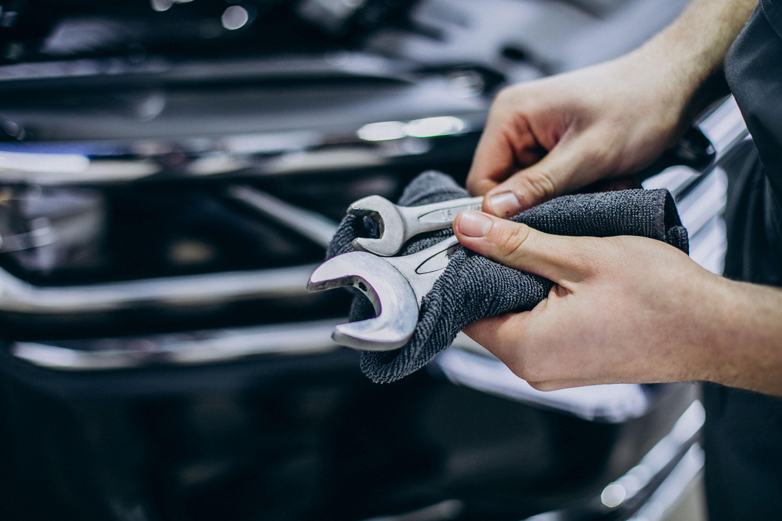 repair man making car service